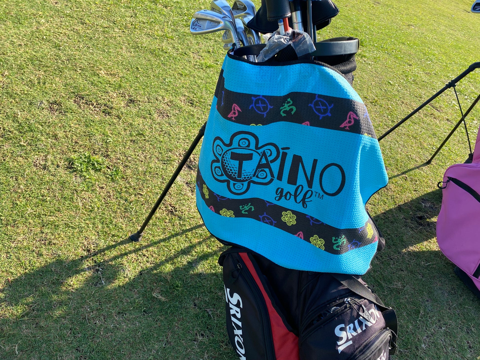 Taino Golf teal, microfibre waffle towel, featuring a durable, absorbent fabric for cleaning golf clubs and hands, with native inspired design and Taino Golf branding.