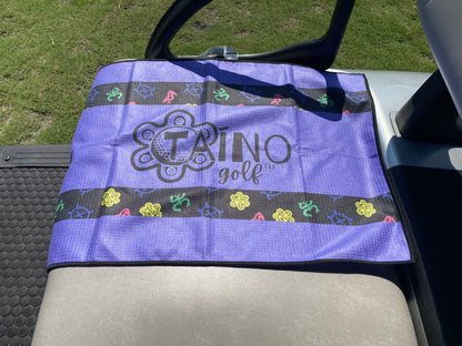 Taino Golf purple, microfibre waffle towel, featuring a durable, absorbent fabric for cleaning golf clubs and hands, with native inspired design and Taino Golf branding.